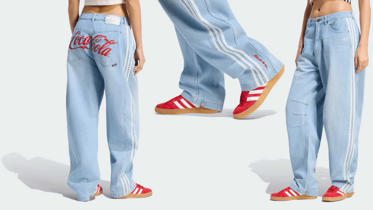 Light blue baggy denim jeans with white side stripes and a large red Coca-Cola logo printed across the back pockets.
