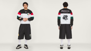 Man wearing a black and white fleece sweatshirt and oversized shorts from front and back, adidas fashion collection.