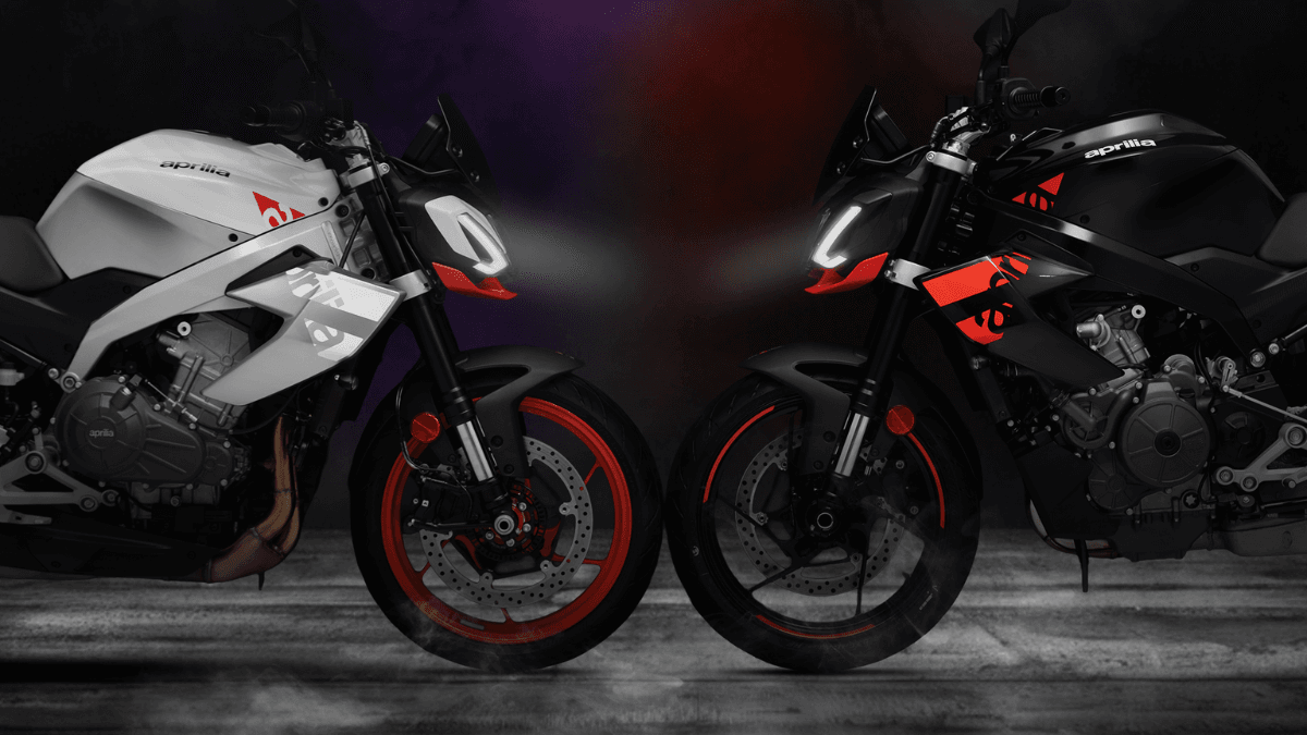 Puma Grey and Mamba Black Aprilia Tuono 457 motorcycles facing each other with illuminated LED headlights in India.