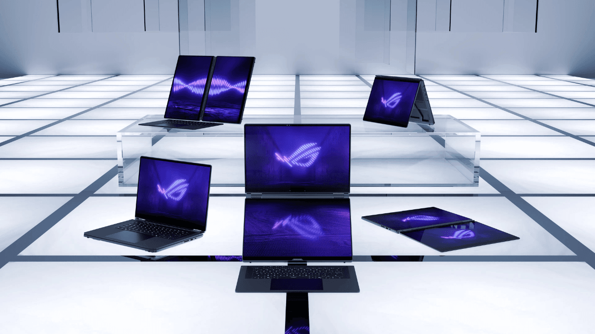 The ultra-thin laptop that makes desktop rigs feel obsolete 3 Five ASUS Zephyrus Duo laptops arranged on a white grid floor showing different screen positions and purple logos.