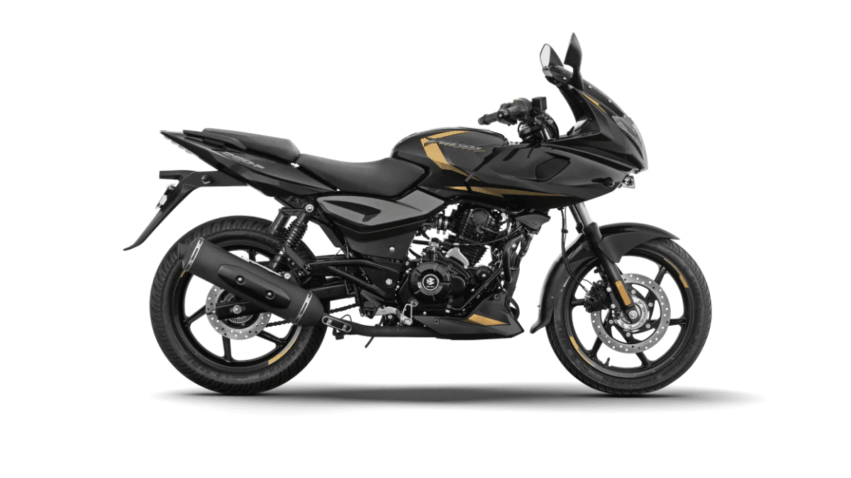 India's cult commuter gets LED projectors at ₹1.36 lakh 2 Side profile of a black Pulsar 220F motorcycle with gold graphics against a plain white background variant.