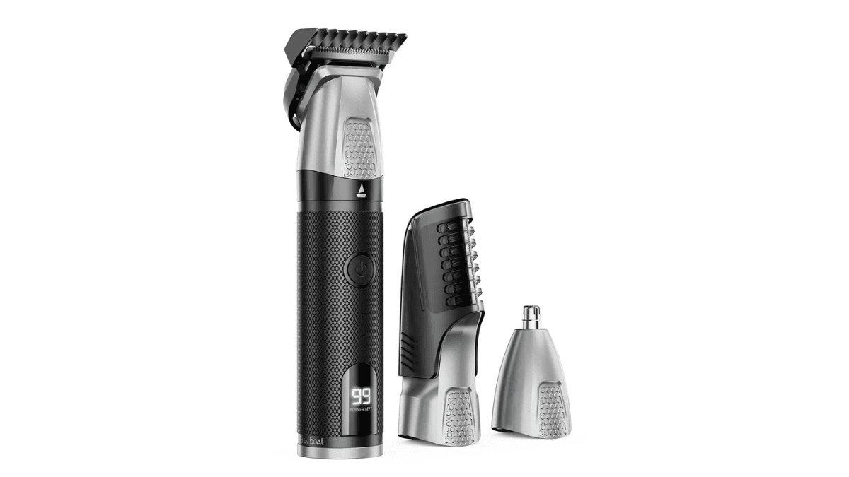 The waterproof grooming kit that fixes your travel charging 2 Silver and black boAt Slazer K100+ multi-grooming trimmer showing a digital battery display alongside interchangeable heads.
