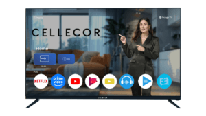 A Cellecor smart TV screen showing a Google TV interface and a woman in a suit pointing during the India launch.