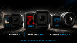 Three GoPro Mission 1 cameras on a dark surface, the rightmost displaying an interchangeable cinema lens for India.