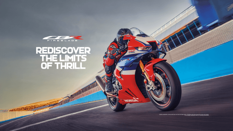The 217 bhp street legal superbike built for the racetrack 2 A racer steering a red and blue Honda Fireblade motorcycle on a racetrack circuit for its India arrival.