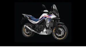 Honda XL750 Transalp motorcycle in tricolour livery with gold spoked wheels on a black background, coming to India.