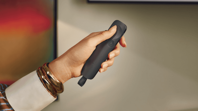 The new device that could cure your presentation nerves 1 Hand holding a sleek dark grey Logitech Spotlight 2 presentation remote control highlighting its ergonomic force sensitive...