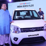 White Maruti WagonR flanked by Nitin Gadkari and Hardeep Singh Puri at a flex-fuel launch event.