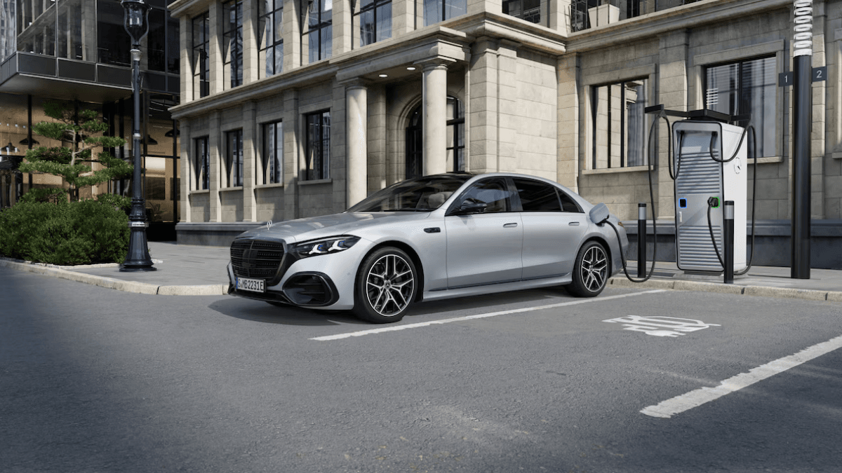 The first plug-in hybrid Mercedes S-Class reaches India 1 Silver Mercedes-Benz S-Class sedan plugged into an outdoor charging station, showing its PHEV capability for city driving.