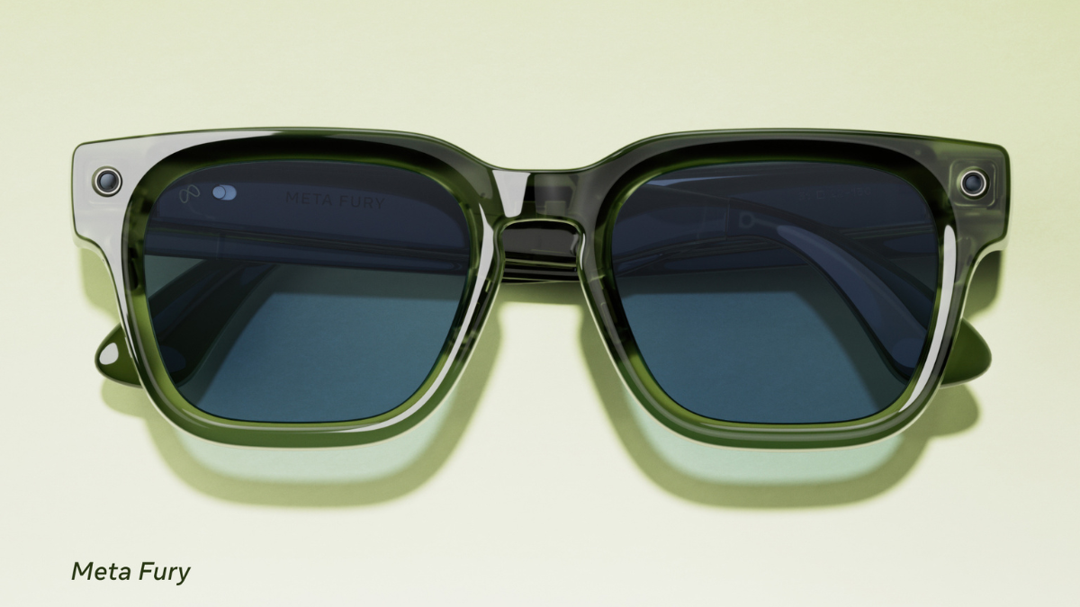 Translucent green bold spectacles with corner camera lenses on a light background, displaying the Fury style frame.