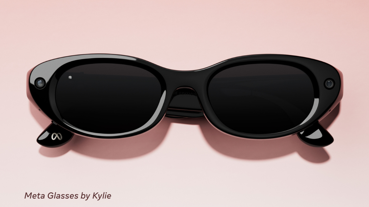 Black slim oval spectacles with corner camera lenses on a pink background, displaying the Kylie style collaboration.