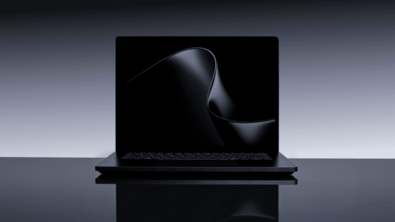 The hardware leap that changes local AI processing forever 4 A black laptop open on a glossy surface displaying a smooth dark wave on screen, previewing premium Windows hardware.