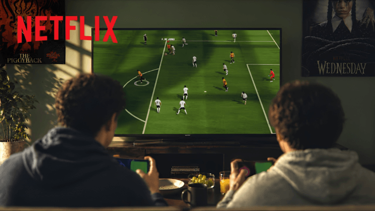 Is your television about to replace an expensive gaming console? 7 Two people on a couch using smartphones as controllers to play a football game on a television with the Netflix logo.
