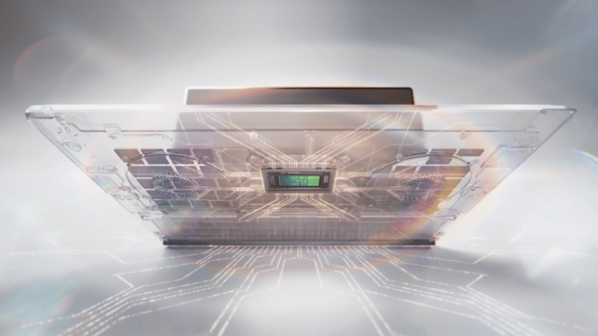 The hardware leap that changes local AI processing forever 2 An upside-down laptop showing internal circuits, dual fans, and a central processor chip under bright lens flares.