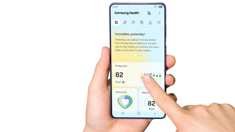 Hand holding smartphone showing Samsung Health app dashboard with Energy Score widget on screen in India.