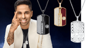 Suryakumar Yadav next to three gold cricket pendants showing diamond settings and engraved signature in India.