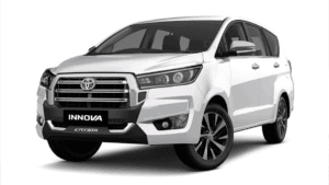 White Toyota Innova Crysta MPV showing the refreshed front radiator grille and bumper for its premium India launch.