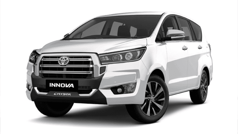 White Toyota Innova Crysta MPV showing the refreshed front radiator grille and bumper for its premium India launch.