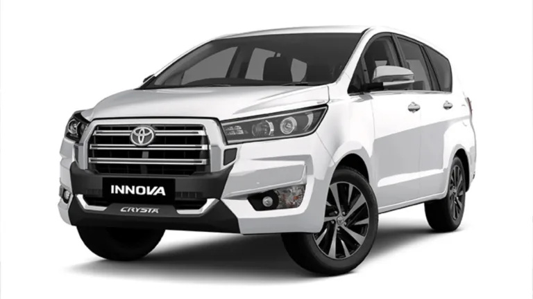 White Toyota Innova Crysta MPV showing the refreshed front radiator grille and bumper for its premium India launch.