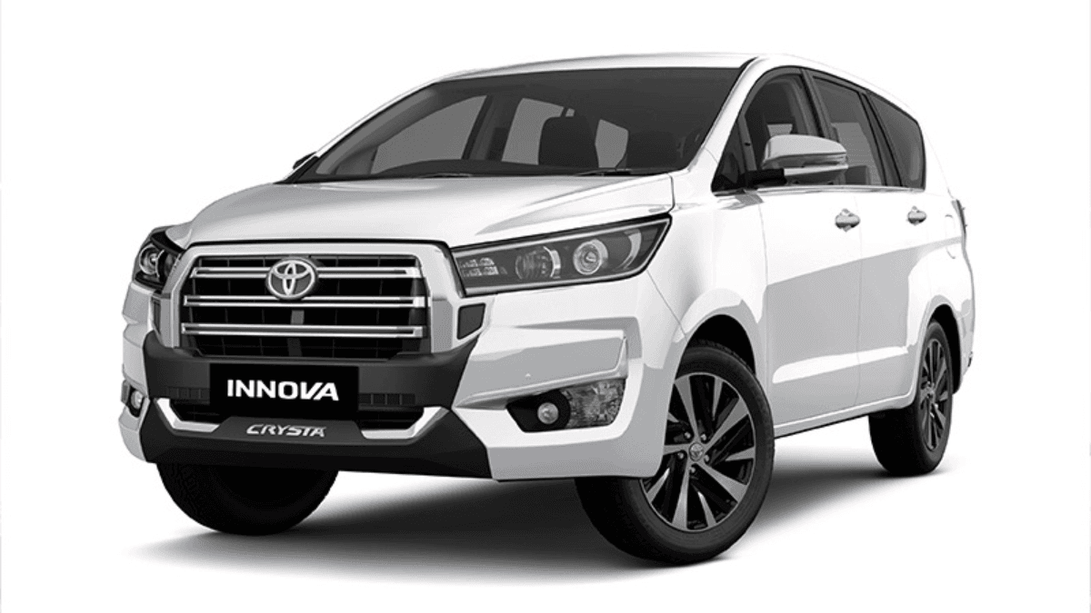 White Toyota Innova Crysta MPV showing the refreshed front radiator grille and bumper for its premium India launch.