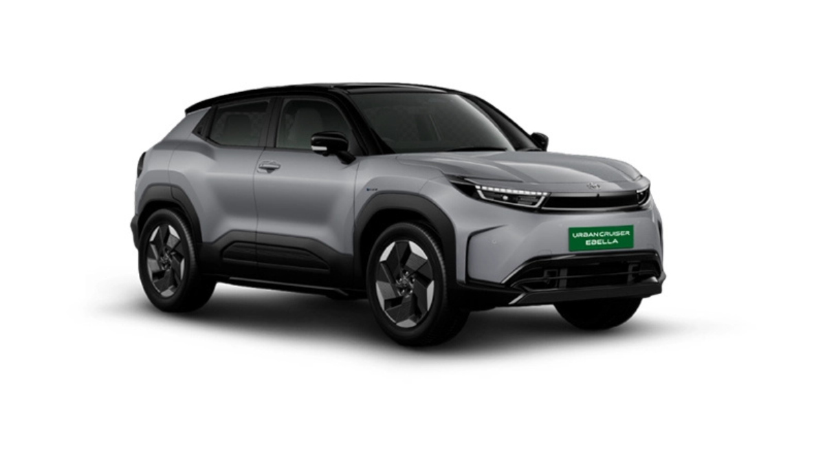 A silver and black dual-tone Toyota Urban Cruiser Ebella EV shown from a three-quarter angle against a white background.