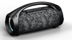 Camouflage print portable speaker with a top handle and illuminated blue LED ring on a white studio background.