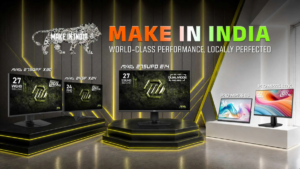 Five MSI monitors on display stands against a dark wall featuring a mechanical lion logo and Make in India text.