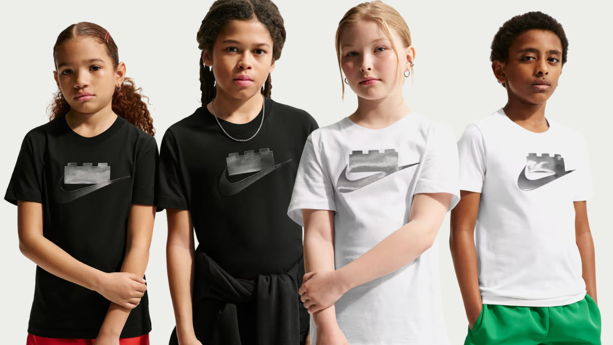 Air Max 95 gets a brick makeover starting at ₹10,095 2 Four children wearing black and white t-shirts featuring a silver Nike Swoosh topped with toy studs on a plain background.