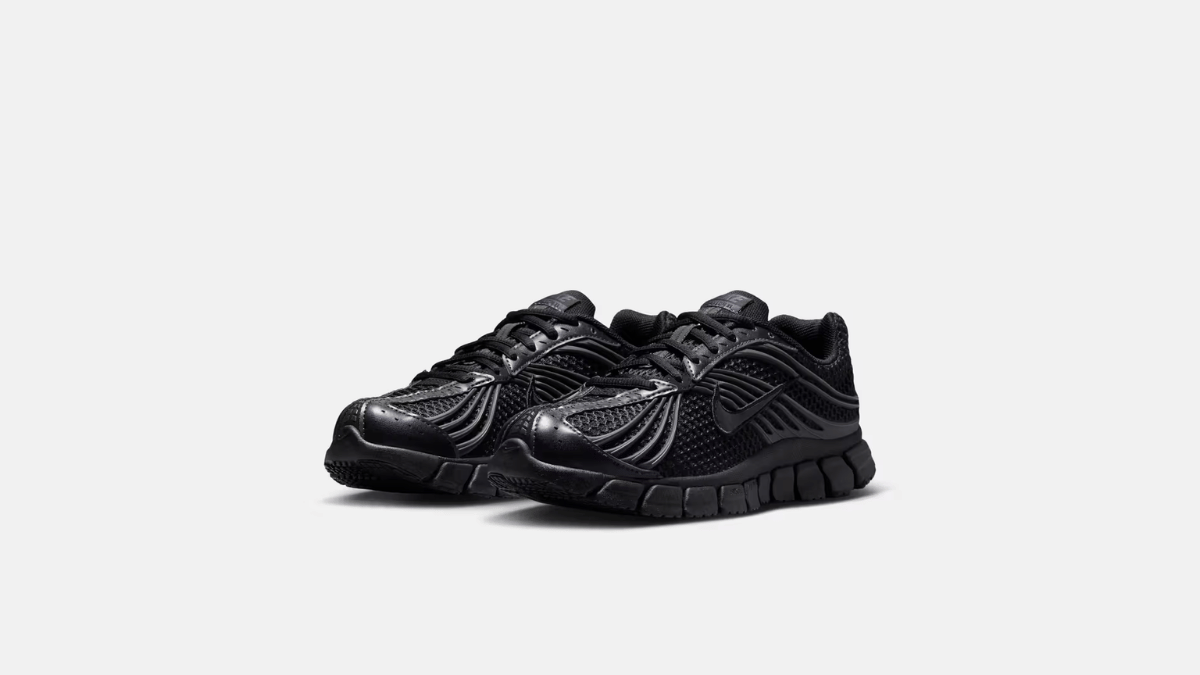 The retro sneaker that finally gets all-day comfort right 2 All-black mesh and synthetic runner on a grey backdrop, highlighting the model's stealthy streetwear architecture.