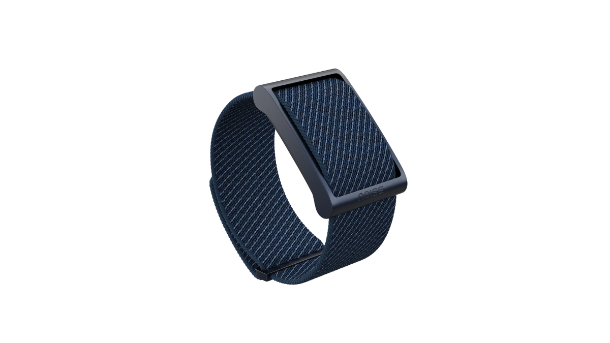 At ₹7,999 this screenless tracker charges no monthly fees 1 A single navy blue screenless fitness tracker with a textured fabric strap floating against a plain white background.