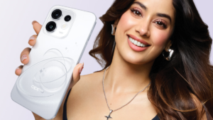 A white smartphone with a circular design held by a smiling woman with long hair against a purple backdrop.