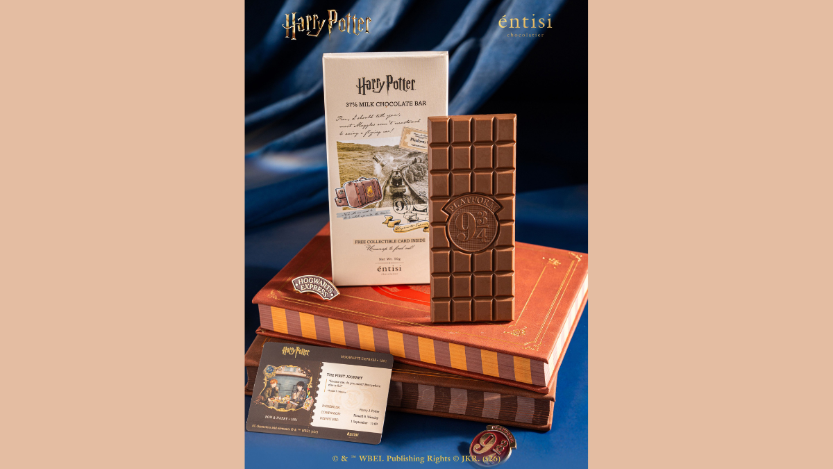 Official wizarding chocolates hit Blinkit starting at Rs. 129 1 Collectible ticket card, badge pins, Platform 9 3/4 chocolate bar, white product box, stacked books display.