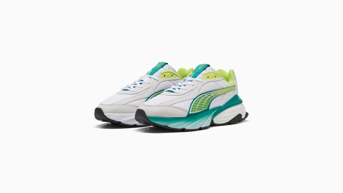 The streetwear drop that finally ignores loud F1 fanwear 1 Pair of white sneakers with green and lime shimmer overlays on a thick sculpted midsole facing front left.
