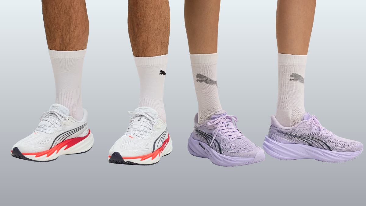 The wide-fit option that could end cramped toes for runners 2 Close-up of lower legs wearing white socks with white and red shoes on the left and lavender shoes on the right.