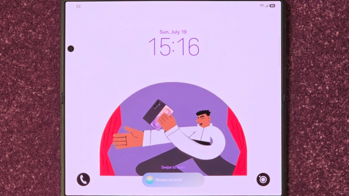 Samsung splits its foldable range into two distinct designs 1 Unfolded Samsung Galaxy Z Fold8 main screen lying flat on a purple textured surface showing lock screen artwork.
