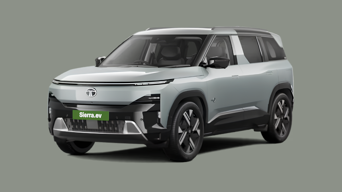 A classic nineties design brings theatre tech to your drive 1 Silver electric SUV parked showing front three-quarter view and green number plate against a solid grey background.