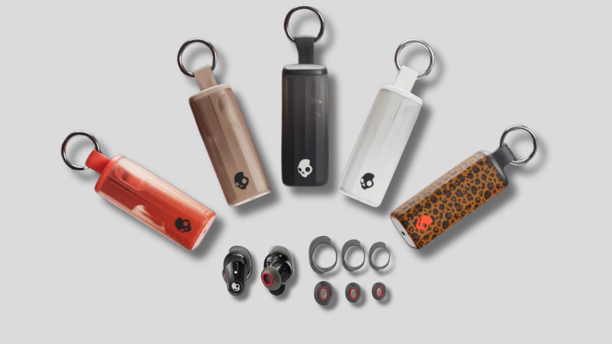 Five wireless earbud cases in red, brown, black, white, and leopard print above black earbuds and ear tips.