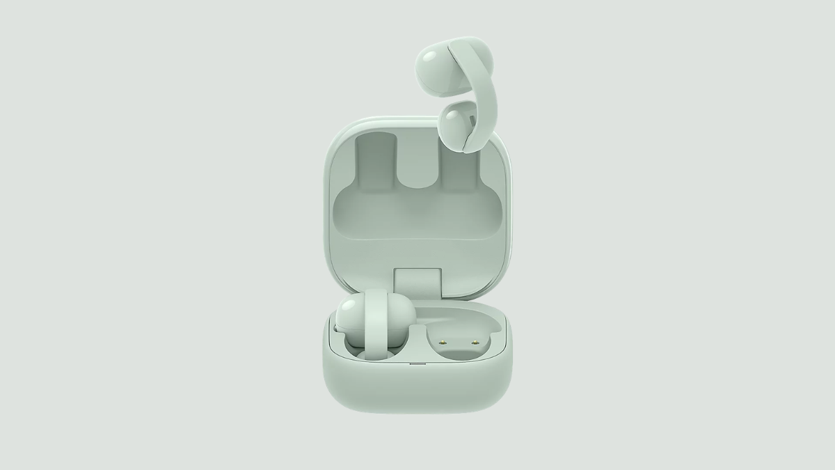 Why urban professionals are switching to open acoustics? 2 An open light green charging case with one earbud inside and another floating directly above the empty right slot.