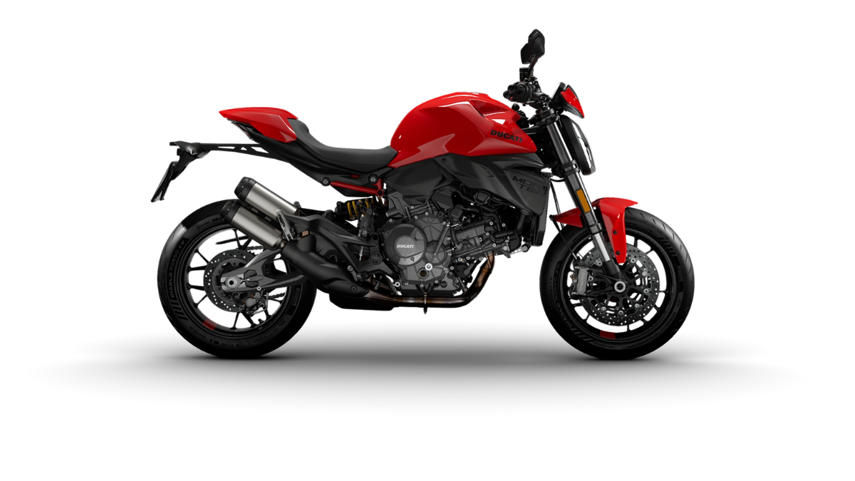 An 890cc twin engine anchors the 2026 Monster street bike in India 1 Red Ducati Monster motorcycle side profile showing engine casing double exhaust pipes and cast alloy wheels.