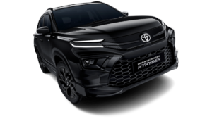 Black alloy wheels, LED DRLs, and dark front grille on the Urban Cruiser Hyryder against white background crossover.
