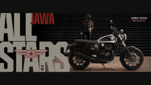 All Stars graphic, rider on dark steps, Jawa 42 FJ All Stars Edition motorcycle parked on pavement exterior.