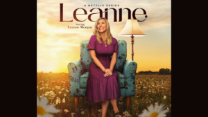 Leanne Morgan in a purple dress smiles from a floral armchair in a daisy field beneath Leanne show title text.