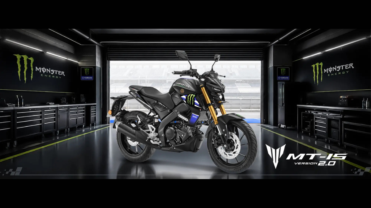 Monster Energy MotoGP liveries land on two 155cc bikes 1 Black rear wheel, exposed engine, green Monster Energy graphics, and golden front forks on the MT-15 Version 2.0 in garage.