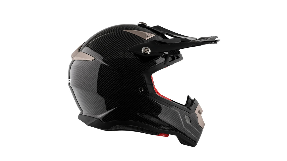 Carbon fibre MX Carbon helmet drops off-road weight for Rs 20,060 1 Rear exhaust vent, glossy carbon weave shell, visor mount screw, and extended peak visor in profile view.