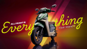 Yellow lettering surrounds a green and beige BGauss C12 MaxR scooter set against an orange and red backdrop.
