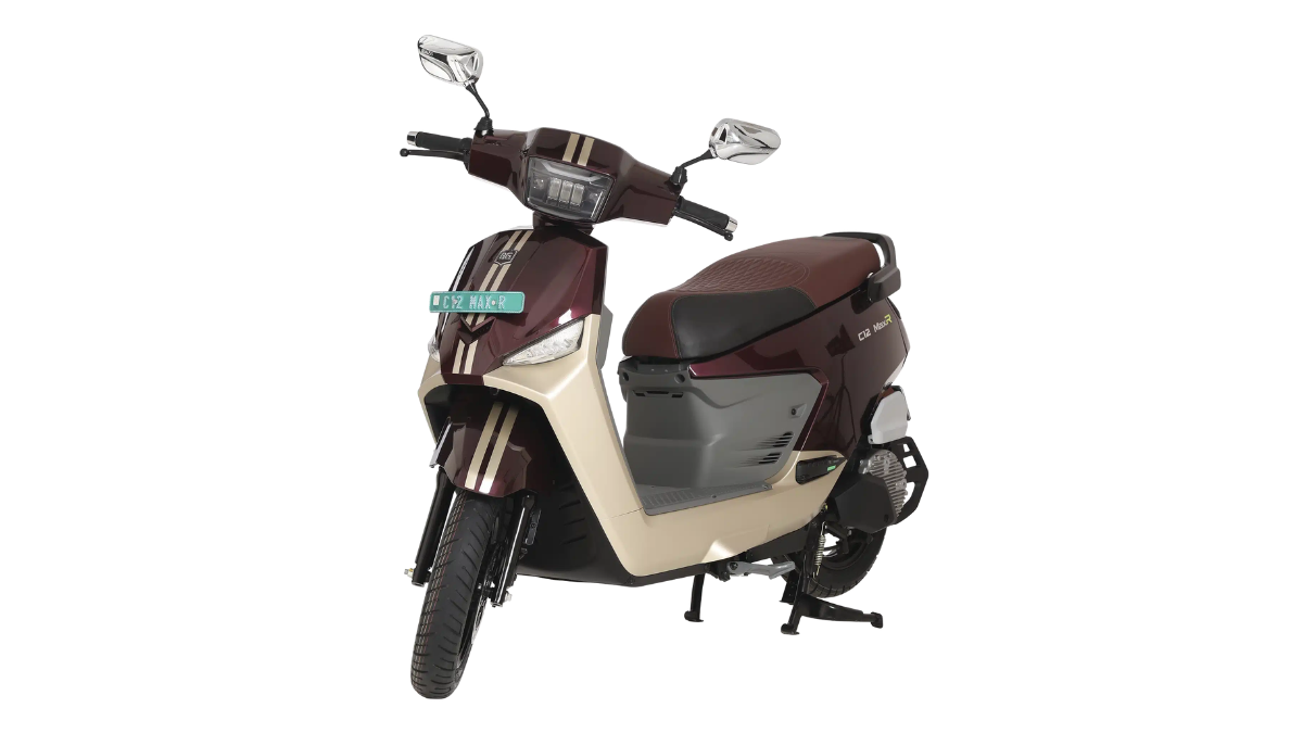 A maroon and beige electric scooter rests on its centre stand angled toward the left over a plain white background.