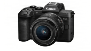 Textured handgrip, RF 24-50mm lens attached to Canon EOS R8 Mark II body, top dials, white background studio.