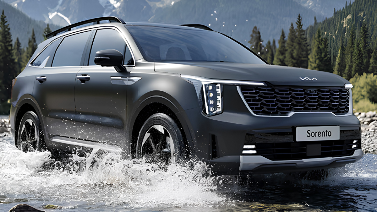 Hybrid Sorento lands on Indian roads with ₹27.99 lakh entry price 1 Dark grey Kia Sorento splashing through stream with evergreen trees and mountain background driving.