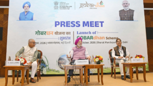Dr. Neeraj Mittal, Hardeep S. Puri, and Alok Tripathi seated in front of a GOBARdhan Scheme backdrop in Delhi event.